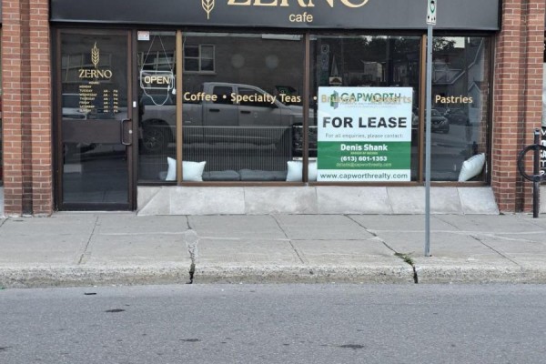 Exterior view of a cafe storefront with large windows displaying "Zerno cafe" signage and "For Lease" posters. - 254 Dalhousie Street, Ottawa