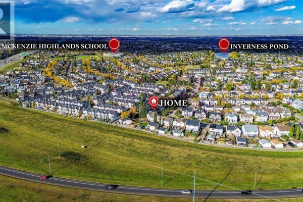 Aerial view of Calgary suburbs, highlighting the home's location near McKenzie Highlands School and Inverness Pond. - 254 Elgin View Se, Calgary