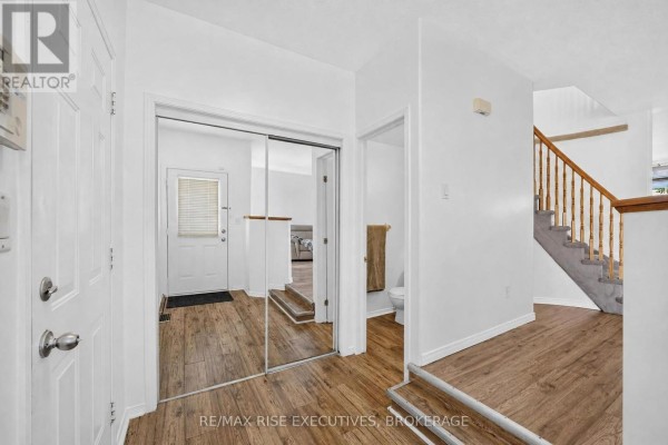 Interior entryway with a closet, door to bathroom, and staircase. - 254 Ellesmeer Avenue, Kingston