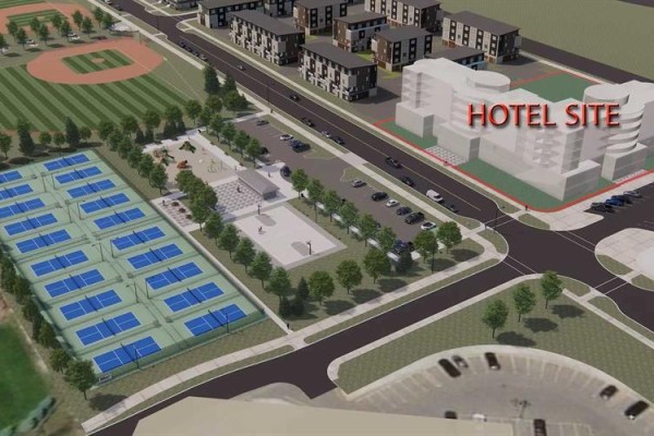 Architectural rendering shows pickleball courts, basketball court, playground, apartment buildings, and a hotel site. - 255 Rockland Avenue, Cochrane