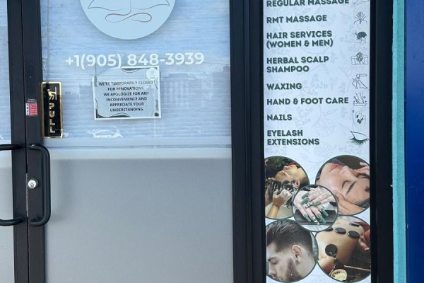Close-up of the spa entrance featuring services offered and contact information. - 2551 Hurontario Street, Mississauga