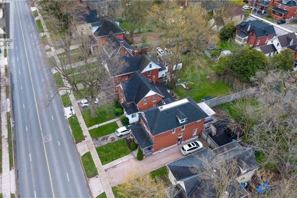 Aerial view of a street with houses and cars, showing 257 Ontario Street from above. - 257 Ontario Street, Stratford