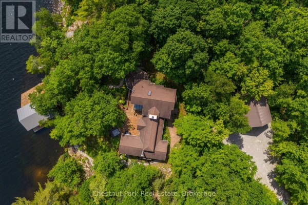 Overhead view of the Georgian Bay home, deck, and surrounding forest landscape. - 257 Sweets Portage Road, Georgian Bay
