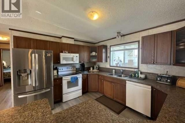 Living room - 26, 15 Mackenzie Ranch Way, Lacombe, AB T4L0A7 Photo 4