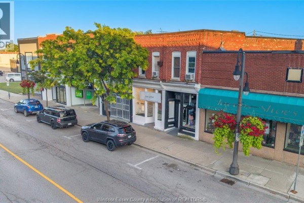 Aerial view of a street lined with commercial buildings and parked cars. - 26-30 Talbot Street East, Leamington