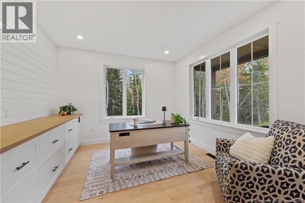 Home office with white shiplap accent wall and a large desk. - 26 Maefield Street, Lower Coverdale