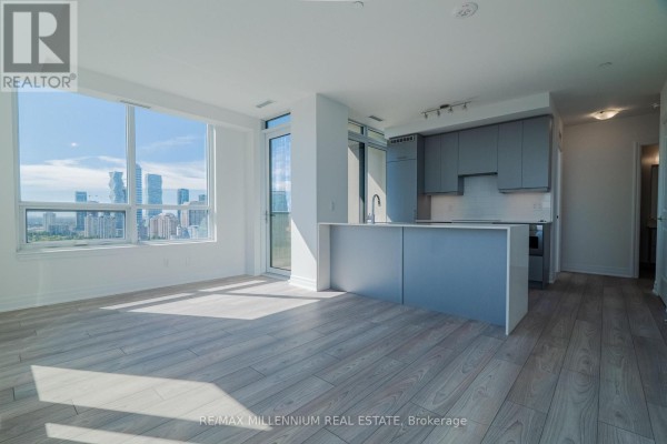 Contemporary kitchen featuring light blue cabinetry, white subway tile backsplash, and stainless steel appliances. - 2607 - 36 Elm Drive W, Mississauga