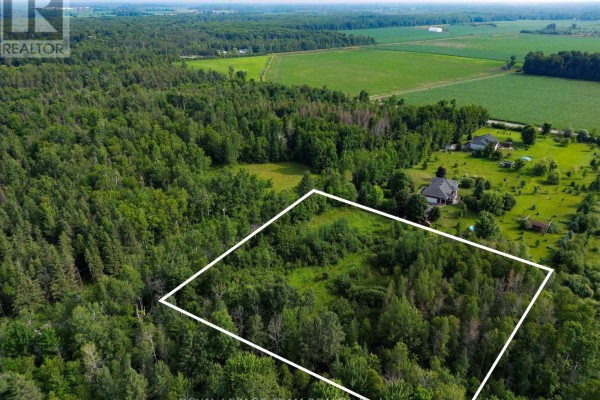 View from above of forested land with a white boundary line defining the lot. - 2630 Mcmullen Road, Ottawa