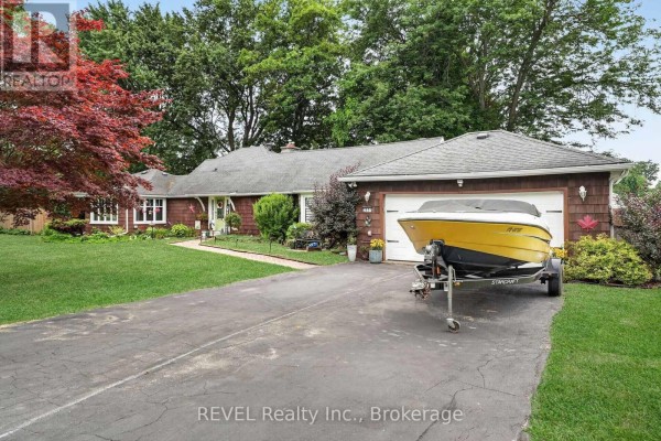 Aerial view showing the property's location near a large body of water and surrounding landscape. - 2631 Thompson Road, Fort Erie