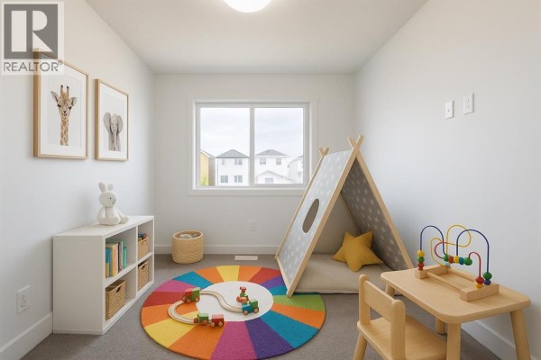 Children's playroom featuring a tent, colorful rug, and bookshelves - 264 Clearview Court, Chestermere