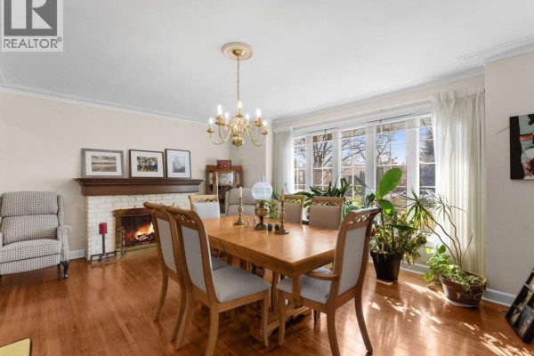 Entryway with glass-paneled door and view into dining area - 264 Patrice Drive, Windsor