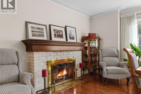 Hallway with hardwood flooring and doors leading to other rooms - 264 Patrice Drive, Windsor