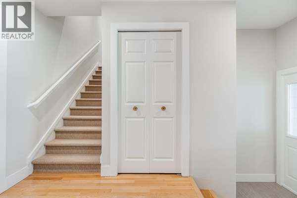 Open living area with view to dining space, hardwood floors, and natural light. - 2685 Byron Road, North Vancouver