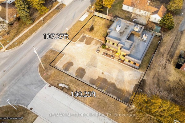 Aerial view showing the commercial property boundaries, building, and asphalt parking lot. - 2695 Hamilton Road, Sarnia