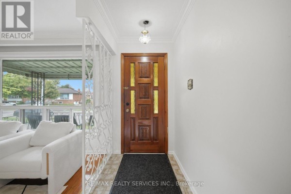Ornate wooden front door with frosted glass - 27 Edgemont Drive Brampton