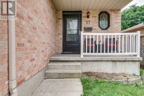 Close-up of the front door, concrete steps, and brick facade of the house. - 27 Gerald Crescent, London South