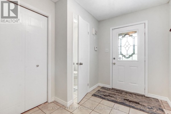 Interior entryway with tiled floor, white doors, and a decorative rug. - 27 Gerald Crescent, London South