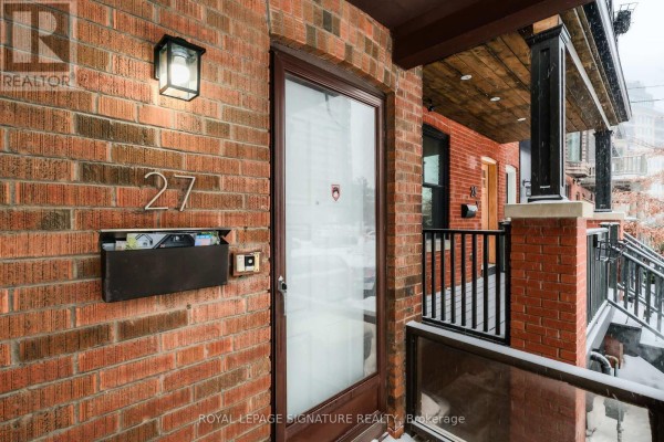 Entrance with brick facade, doorbell, and mailbox. - 27 Hillsboro Avenue, Toronto