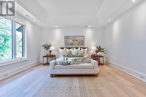 Tray ceiling bedroom with large window and hardwood floors - 27 Hurlingham Crescent Toronto
