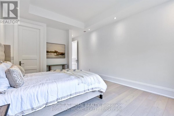 Bedroom with king bed, tufted headboard, and artwork - 27 Hurlingham Crescent Toronto