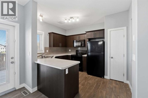 Dining room - 27 Rowberry Court, Sylvan Lake, AB T4S0L7 Photo 2