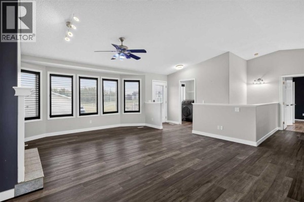 Family room - 270092 Glenmore Trail, Rural Rocky View County, AB T0J1X0 Photo 4