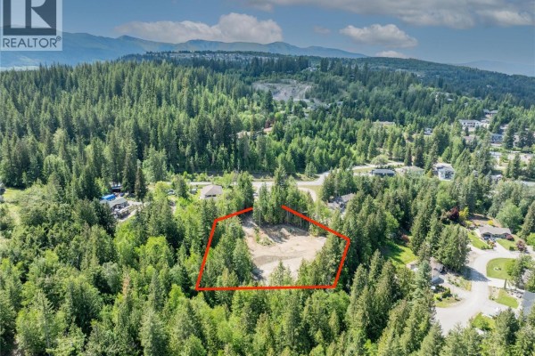 Cleared construction site with piles of gravel and dirt mounds. - 2744 Lake Mount Place, Blind Bay
