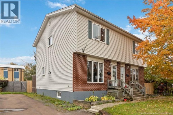 Side exterior view of the duplex at 275-279 Ayer showing side windows. - 275-279 Ayer, Moncton
