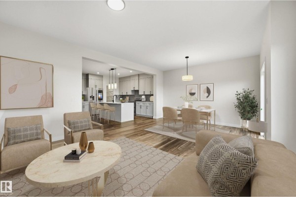 Open concept living, dining, and kitchen area with light wood floors and neutral-toned furniture. - 276 Lodge Pole Pl, Leduc