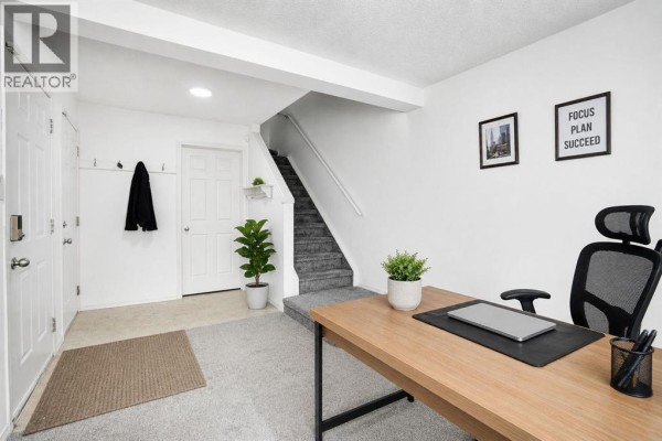 Living room - 28, 200 Hidden Hills Terrace Nw, Calgary, AB T3A6E8 Photo 2