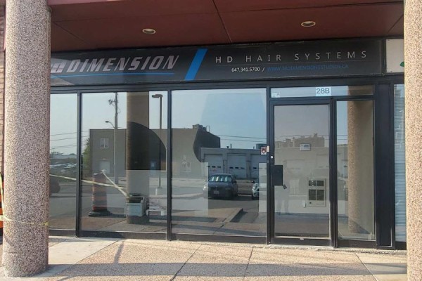 Storefront with large glass windows displaying "HD Hair Systems" signage. - 28 - 3200 Dufferin Street, Toronto