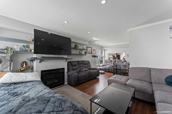 Living room featuring sectional sofas, entertainment unit, and recessed lighting - 28 13713 72a Avenue, Surrey