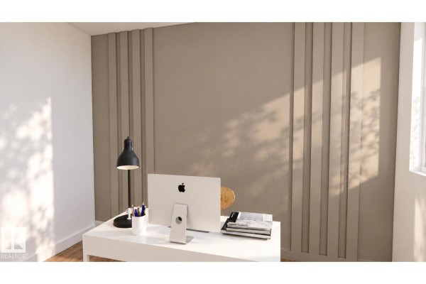 Home office with a white desk, computer, lamp, and decorative vertical wall paneling. - 28 Brickyard Vw, Stony Plain