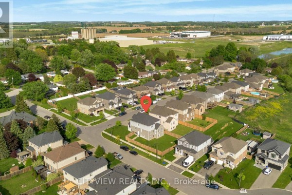 Aerial view of a suburban neighborhood with multiple houses and streets. - 28 Hartfield Street, Ingersoll