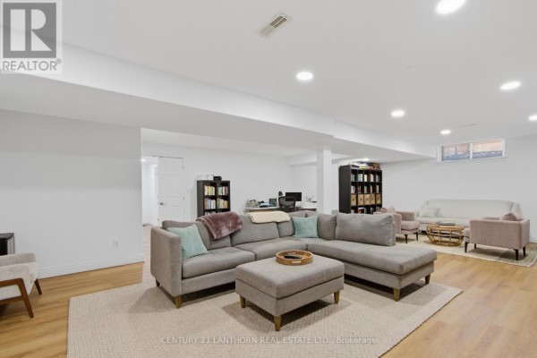 Large sectional sofa and seating area in basement living room - 28 Hickory Grove Belleville