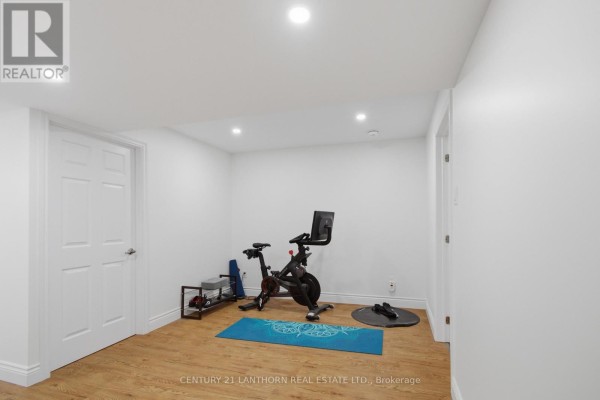 Home gym with Peloton bike, yoga mat, and weights - 28 Hickory Grove Belleville