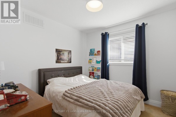 Bedroom with bed, Mandalorian poster, books, and toys - 28 Hickory Grove Belleville