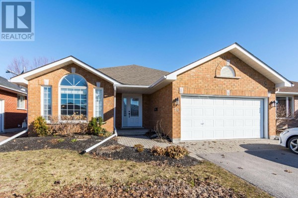 Brick house with arched window and attached garage - 28 Hickory Grove Belleville