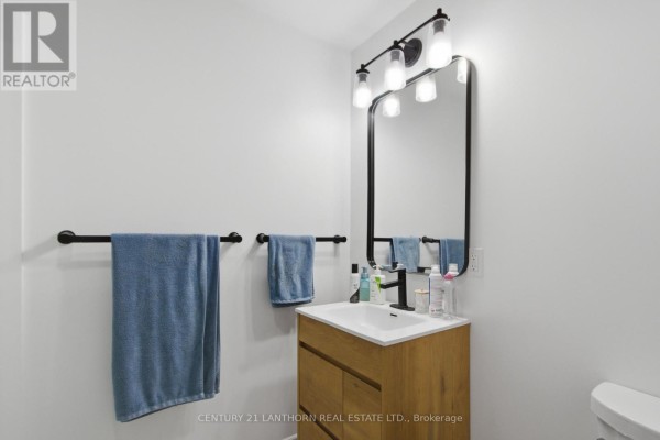 Modern bathroom vanity with wood cabinet and black faucet - 28 Hickory Grove Belleville