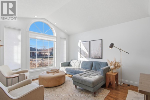 Living room with arched window and sectional sofa - 28 Hickory Grove Belleville