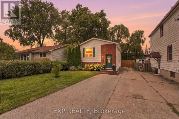 Exterior front view of a house at sunset with vibrant orange and purple sky. - 28 Maitland Street, Thorold