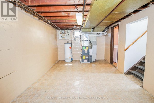 Basement with furnace, water heater, and stairs - 28 Marshall Avenue Welland