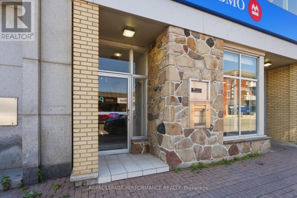 Close-up of the building's entrance with stone and brick exterior. - 280 Main Street E, Hawkesbury