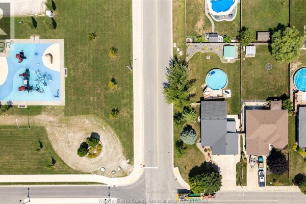 Aerial view of street with park playground on left and residential houses on right. - 280 Mclellan, Amherstburg