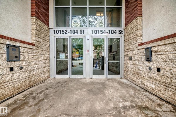 Close-up view of the building's double glass doors with intercoms on the sides. - #2804 10152 104 St Nw, Edmonton