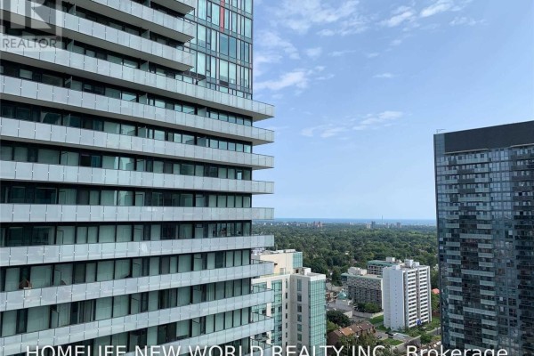 View from a high floor apartment showing city skyline and distant horizon. - 2805 - 161 Roehampton Avenue, Toronto