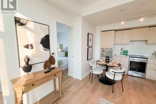Rooftop terrace with a swimming pool, grey lounge furniture, and surrounding high-rise buildings. - 2805 - 501 Yonge Street, Toronto