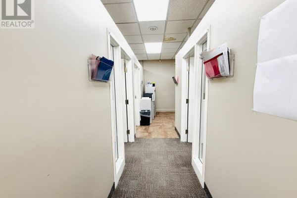 Interior view of reception area with access to adjacent rooms - 281 Queenston Road, Hamilton