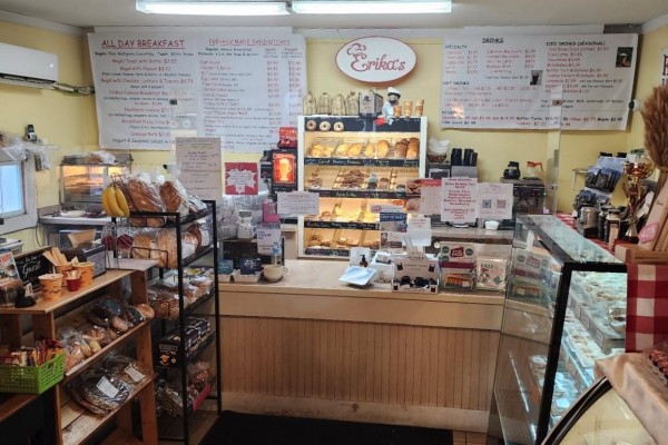 Interior view of Erika's Bakery counter with baked goods, bagels, and menu boards. - 2832 60 Highway, Lake Of Bays