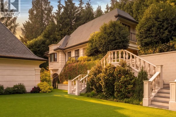 Exterior stone staircase and garden landscaping leading to a separate building structure. - 2867 Marine Drive, West Vancouver